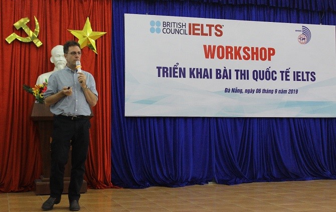 A picture containing floor, indoor, man, standingDescription automatically generated