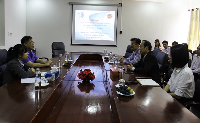 A group of people sitting at a table in a roomDescription automatically generated