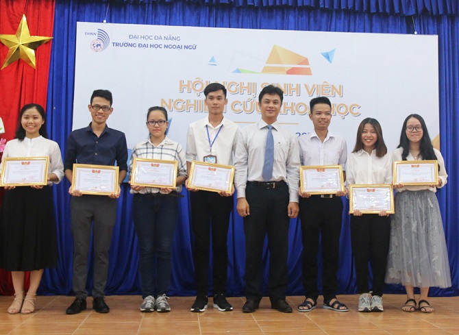 A group of people in a roomDescription automatically generated