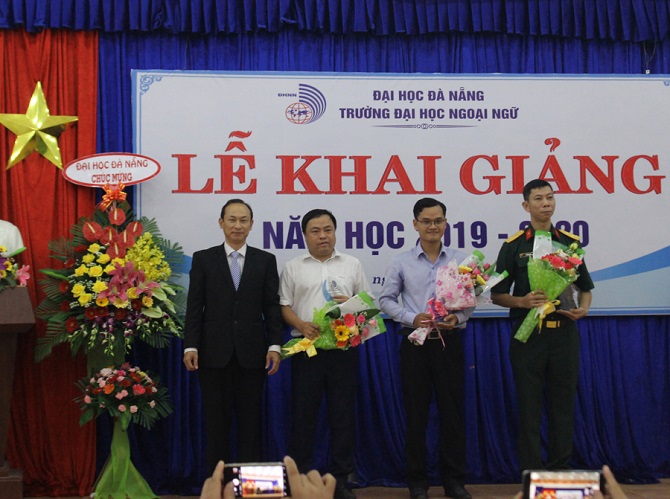 A group of people standing in front of a storeDescription automatically generated