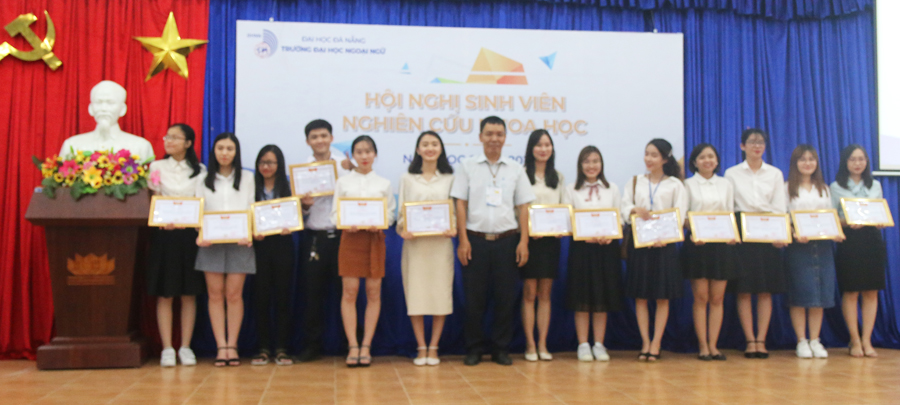 A group of people posing for a photoDescription automatically generated