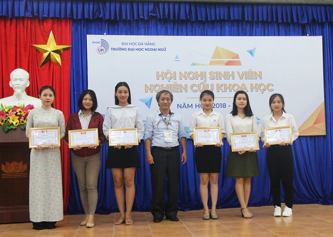 A group of people posing for a photoDescription automatically generated