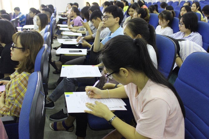 A group of people sitting at a tableDescription automatically generated