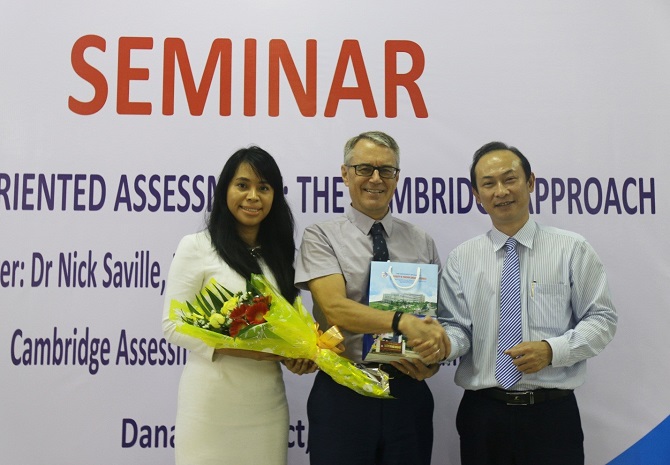 A person holding a signDescription automatically generated