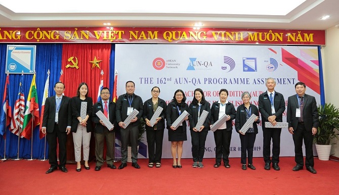 A group of people posing for a photoDescription automatically generated