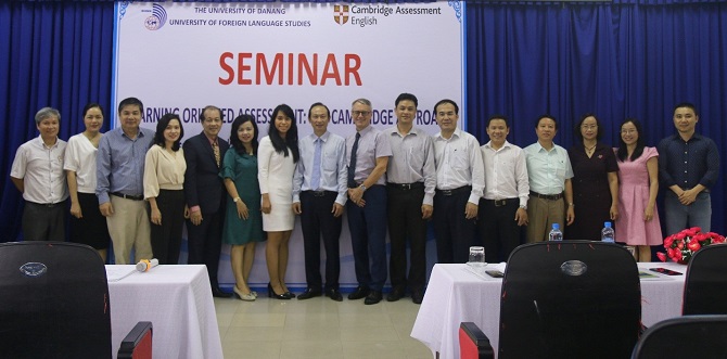 A group of people standing in front of a crowd posing for the cameraDescription automatically generated