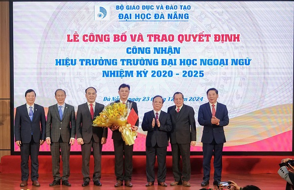 A group of men on a stageDescription automatically generated