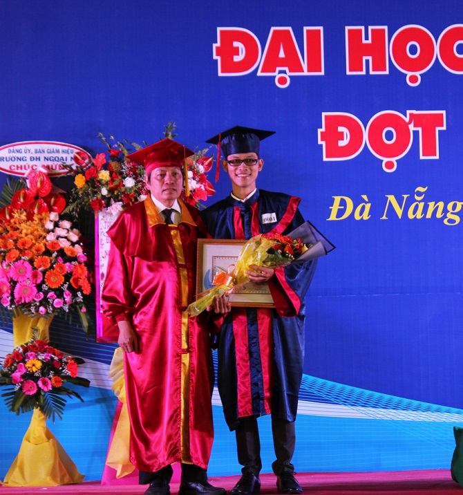 A group of people standing in front of a signDescription automatically generated