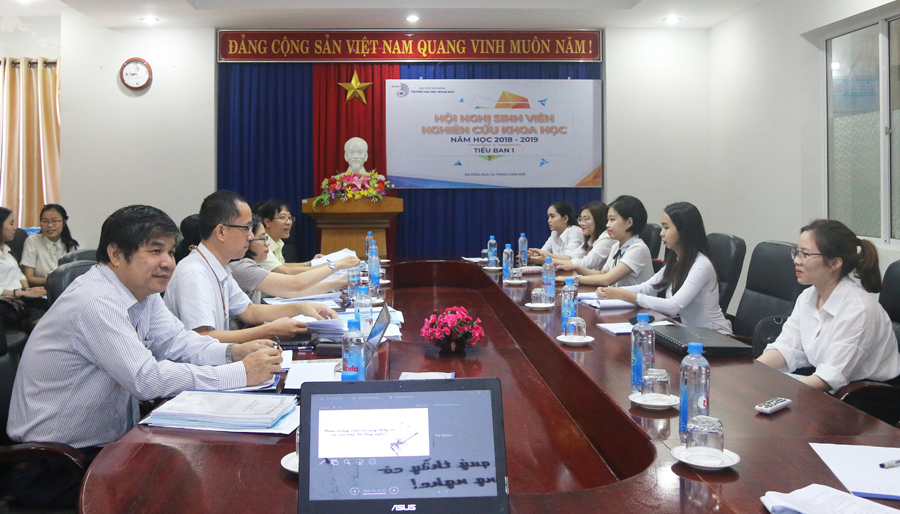 A group of people sitting at a tableDescription automatically generated