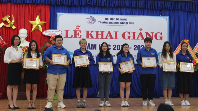 A group of people posing for a photoDescription automatically generated