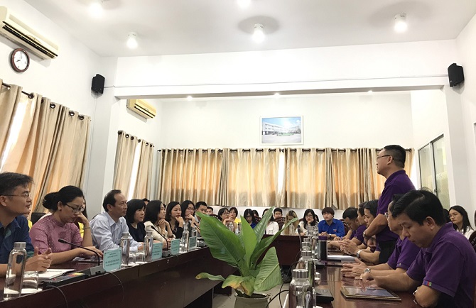 A group of people sitting at a tableDescription automatically generated