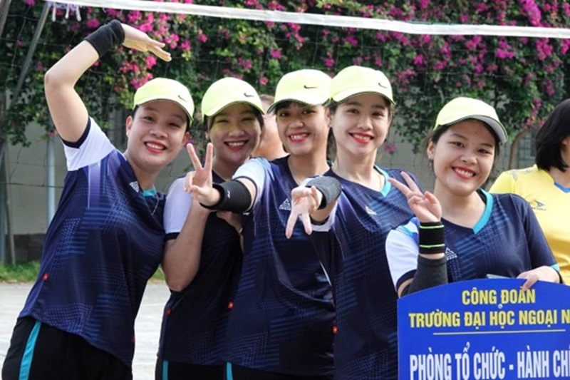 A group of women wearing matching outfitsDescription automatically generated