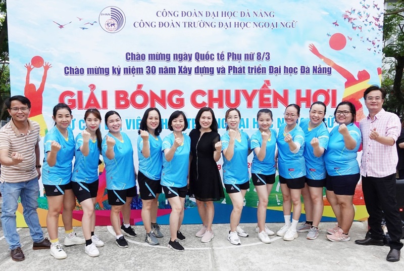 A group of women in matching blue shirtsDescription automatically generated